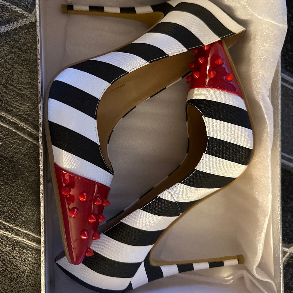 Women’s stiletto pumps studded zebra print